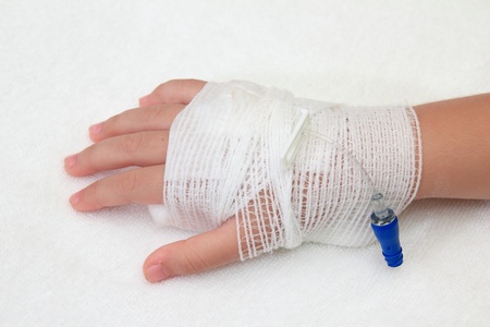 Hand of little girl with bandaged の写真素材