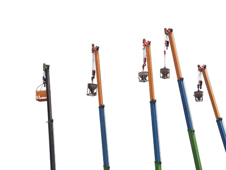 Five tower cranes on isolated backgroundの写真素材