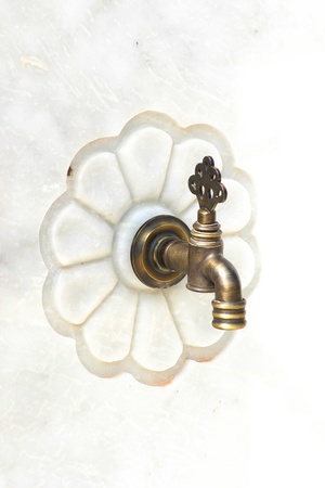 Old style faucet on Marbleの写真素材