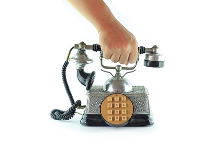 Hand pick up old telephoneの写真素材