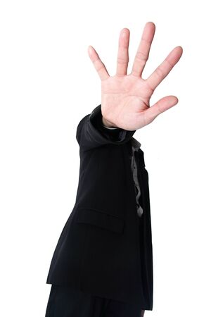 Asian Businessman holding up his hand in a stop sign in a white background.の写真素材