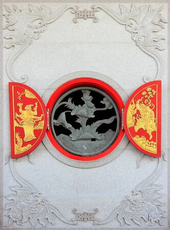 Chinese Water lily windows style at Chinese temple in Thailand.の写真素材
