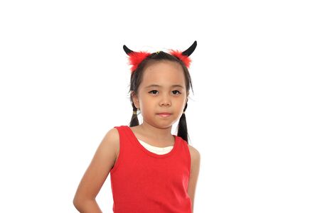 Scary cute little asian girl in red Halloween costume.の写真素材
