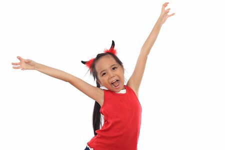 Scary cute little asian girl in red Halloween costume.の写真素材