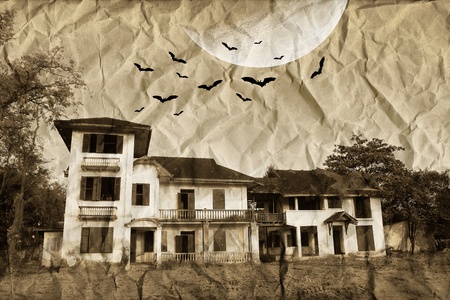 Mysterious house under the moon on crumpled paperの写真素材