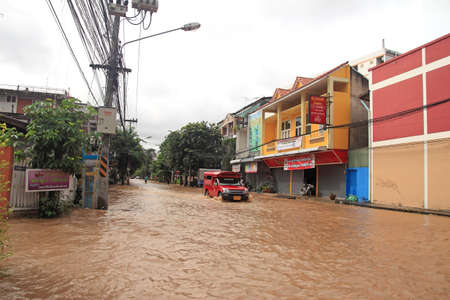 CHIANG MAI THAILAND - SEPTEMBER 29 : Flooding in Chiangmai city.Flooding of buildings near the Ping River on September 29,2011 in Chiangmai, Thailandのeditorial素材