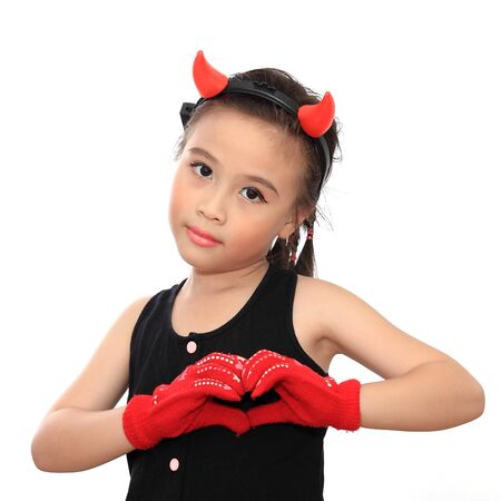Beautiful little asian girl with heart signの写真素材