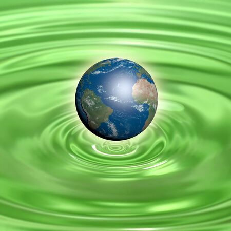 Earth globe on green waterの写真素材