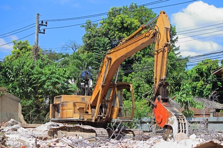 Heavy excavator Destroyed the buildingの写真素材