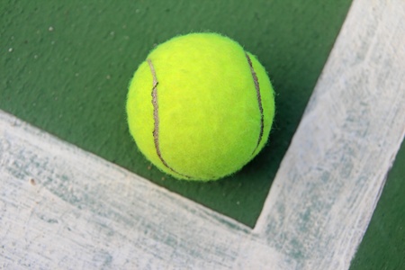 Tennis ball on a tennis courtの写真素材