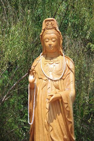 Kuan Yin with bamboo backgroundの写真素材