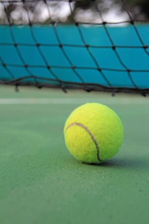 Tennis ball on tennis courtの写真素材
