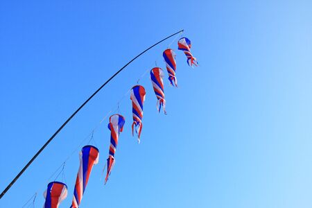 colorful kites in clear skyの写真素材