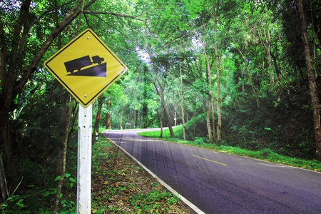 Warning road sign up to hillの写真素材