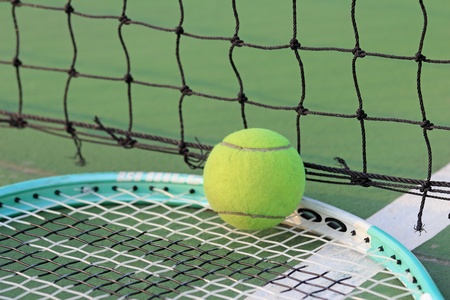 Tennis ball on tennis courtの写真素材