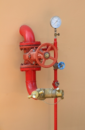 fire hose on a wallの写真素材
