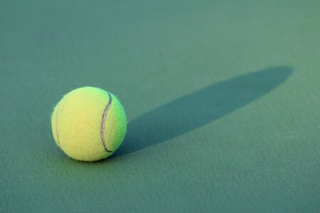 Tennis ball on tennis courtの写真素材