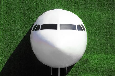Airplane on grass wall