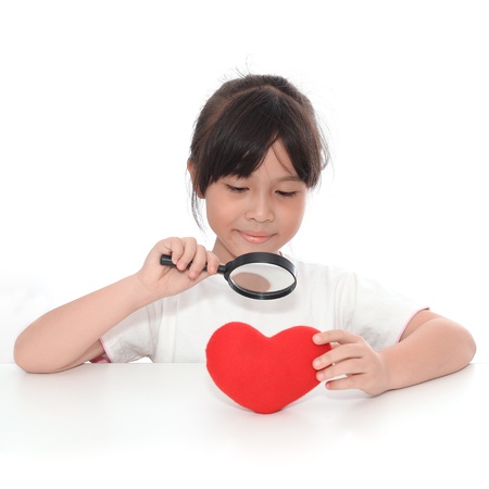 Asian cute girl giving symbol of red heart.の写真素材