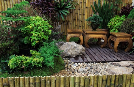 Wooden Desk and chair in the gardenの写真素材