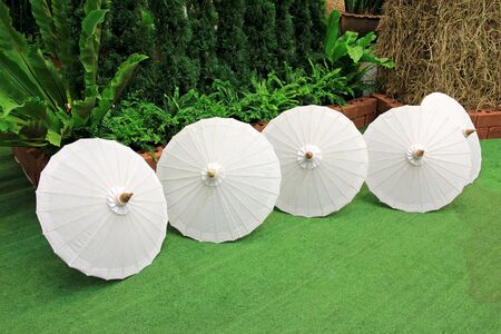 Fabric white umbrella on floorの写真素材
