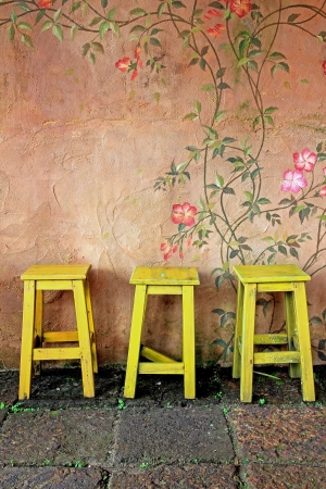 old vintage wooden chair and wallの写真素材