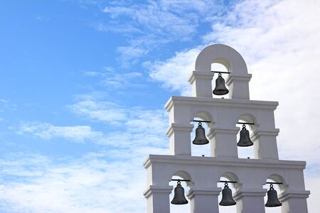 Bell tower under the blue skyの写真素材