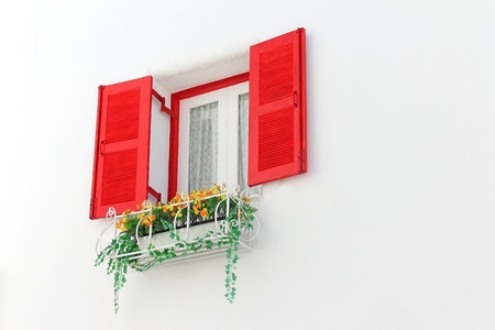 elegant house window with flowerの写真素材