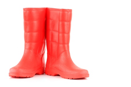 A pair of red rainboots isolated on a white background の写真素材