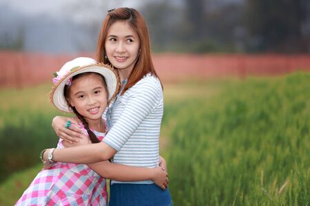 Mother and daughter in the parkの写真素材