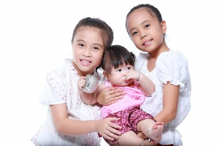 baby and littile girl dressing with thai traditional styleの写真素材