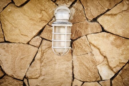 lamp on stone wallの写真素材