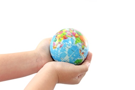 Earth globe in Child hand on white isolated background