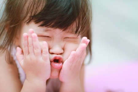 little girl making funny face