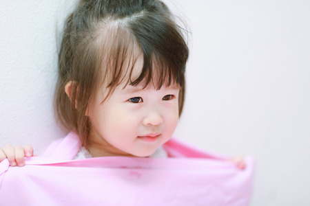 little girl with a fabricの写真素材