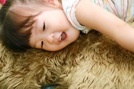 Little girl with big dollの写真素材