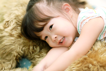 Little girl with big dollの写真素材