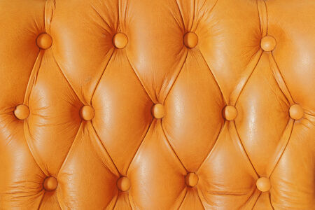 Buttoned on the brown texture from sofaの写真素材