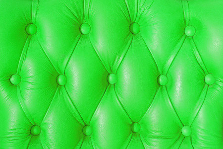 Buttoned on the green texture from sofaの写真素材