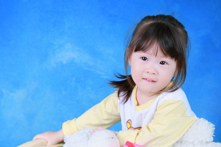 Portrait of little girl with teddy bearの写真素材