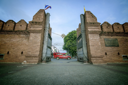 Tha phae gate with Red car Chiang maiの写真素材