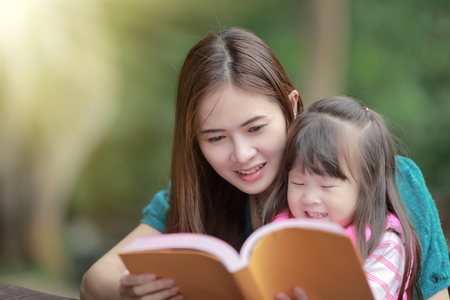 Mother teaching childrenの写真素材