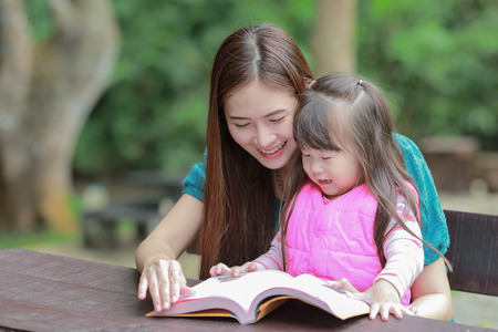 Mother teaching childrenの写真素材