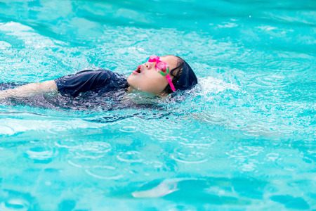 Girl swimming in the poolの写真素材