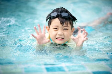 Boy swimming in the poolの写真素材