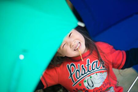 Happy asian little girlの写真素材
