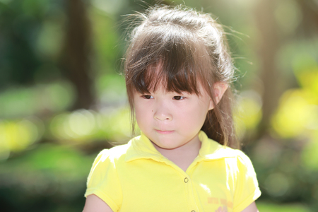 Happy cute little girl outdoors in summer dayの写真素材