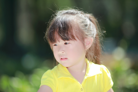 Happy cute little girl outdoors in summer dayの写真素材