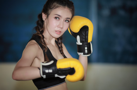 Woman boxing in gym の写真素材