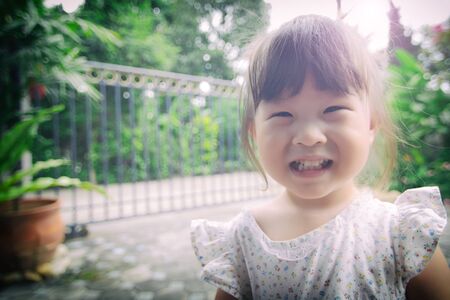 Cute little girl smiling vintage filterの写真素材